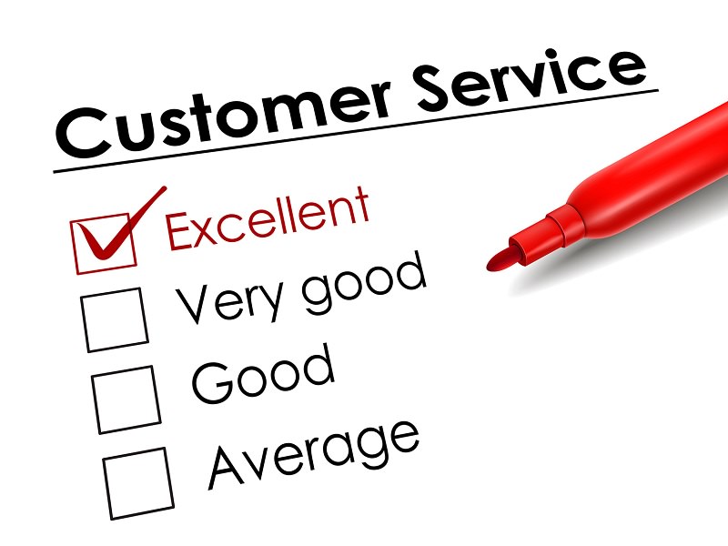 tick placed in excellent check box with red pen over customer service questionnaire